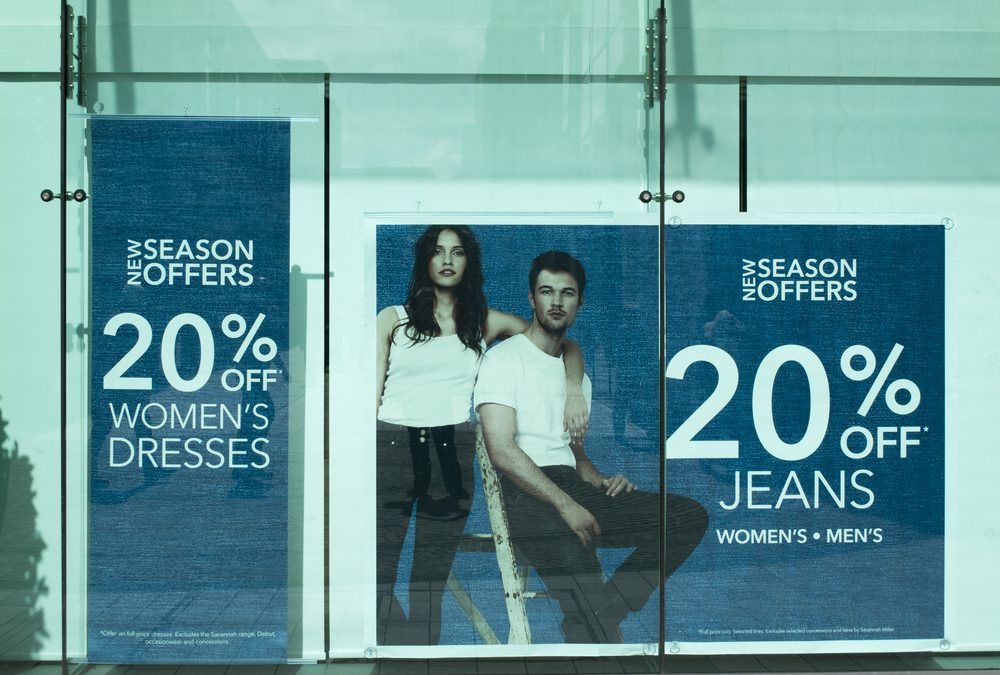 department store window display advertising new season offers