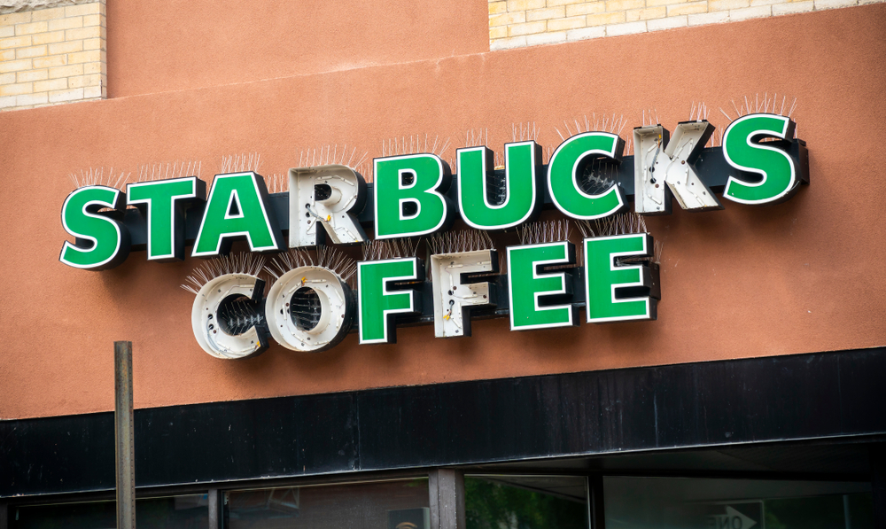 A distressed Starbucks coffee shop sign